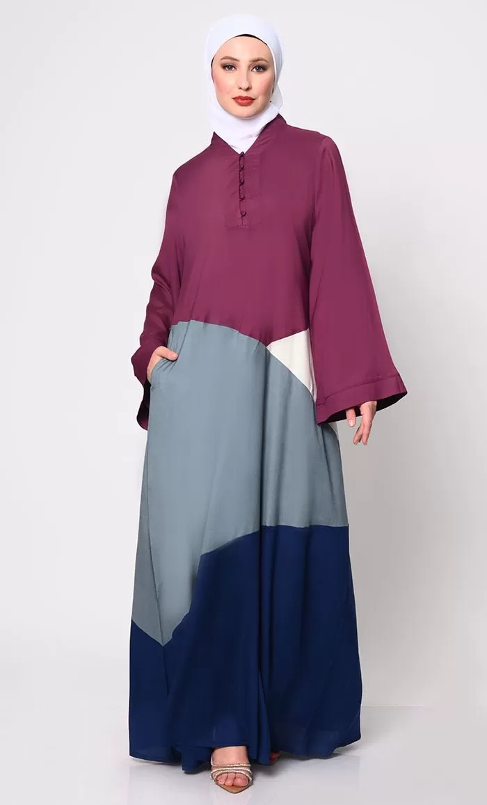 Contemporary Elegance: Abaya with Captivating Color-Blocking Panels and Practical Pockets