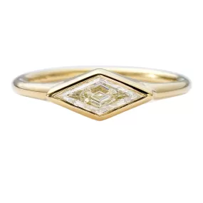 Lozenge Cut Diamond Engagement Ring with a Golden Bezel